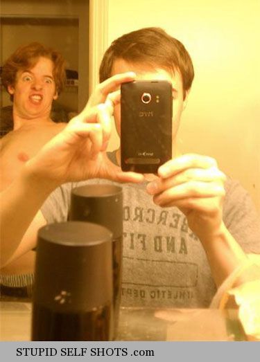 Photobombing your brother, bathroom mirror selfie