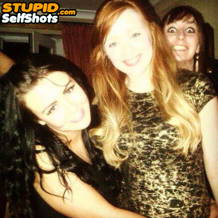 Creepy girl photobombs a groups selfie