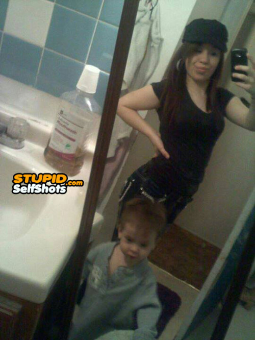 Mom takes a bathroom selfie with her kid
